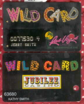 Wild card. One has gold raised name/number. Other has white name/number